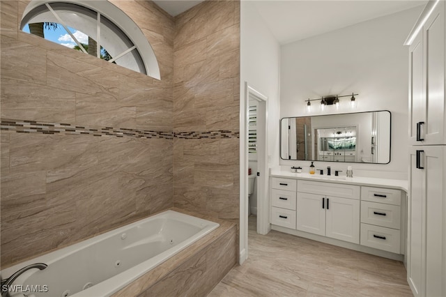 11211 Mahogany Run, Fort Myers, FL 33913 - full bathroom featuring a tub with jets and vanity