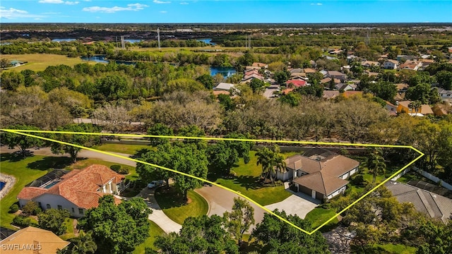 aerial view with a water view and a residential view