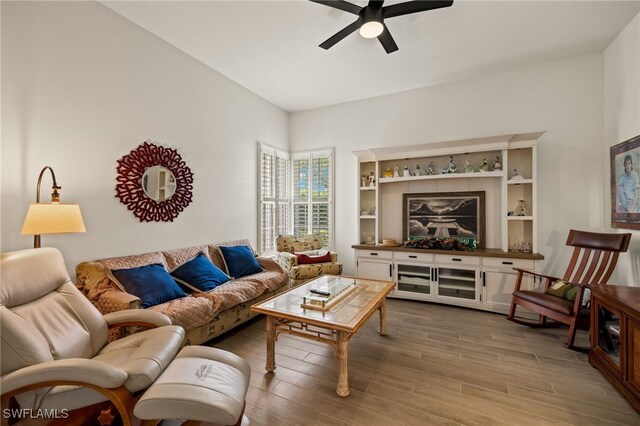 living room featuring ceiling fan and wood finished floors