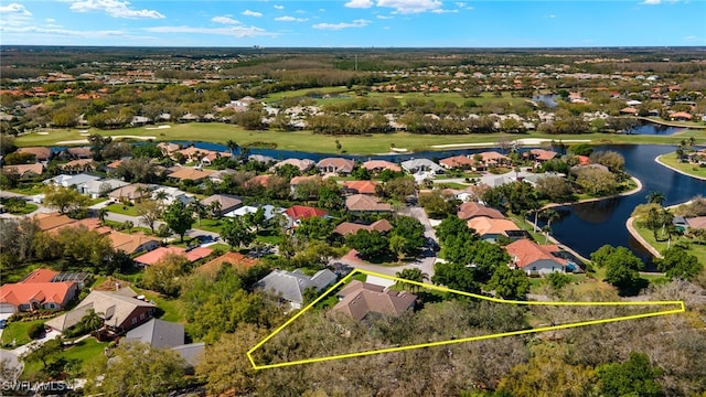 11211 Mahogany Run, Fort Myers, FL 33913 - aerial perspective of suburban area with a large body of water, property boundaries highlighted, and a local golf course