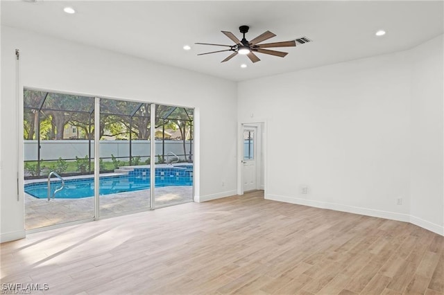 11211 Mahogany Run, Fort Myers, FL 33913 - spare room with ceiling fan, light wood-style floors, and recessed lighting