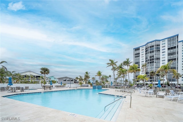 community pool with a patio area