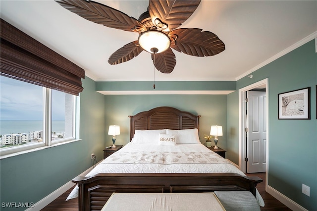 unfurnished bedroom with dark wood-style floors, baseboards, and ornamental molding