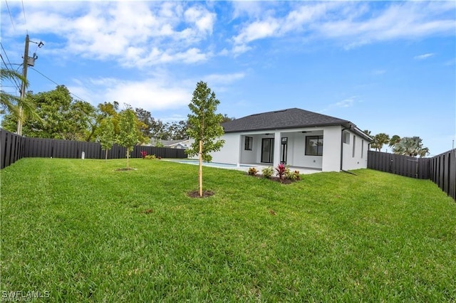 view of yard with a fenced backyard and a patio area