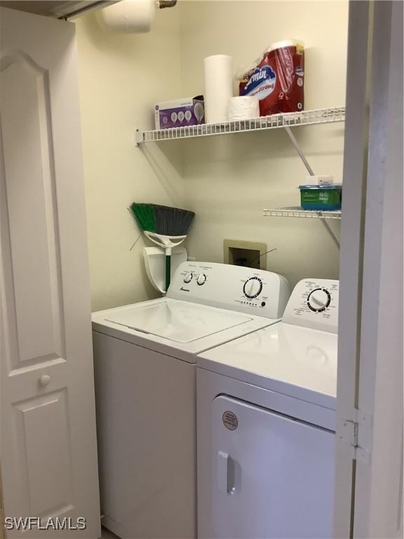 washroom with laundry area and independent washer and dryer