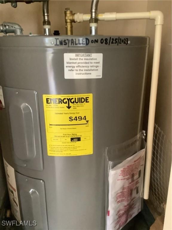 utility room with water heater