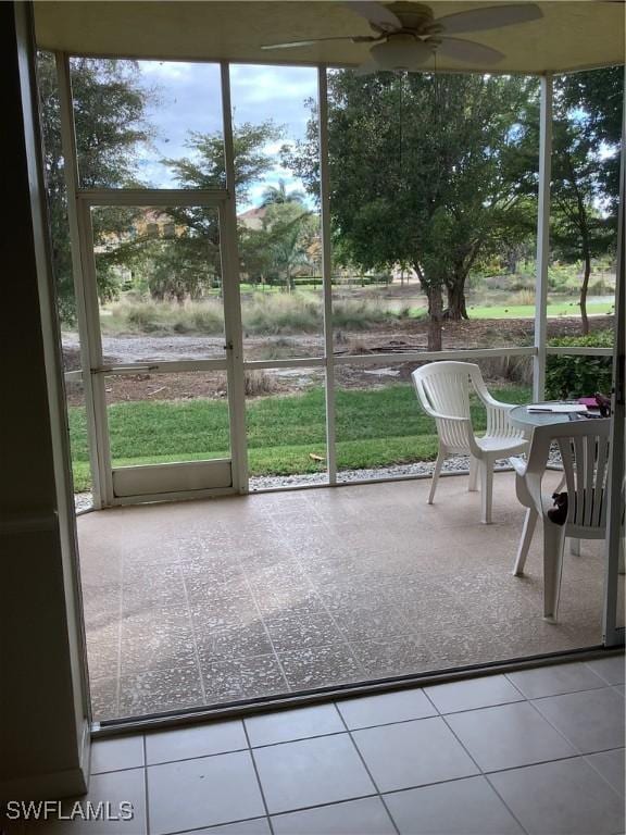 sunroom / solarium with ceiling fan