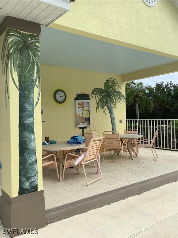 view of patio featuring outdoor dining area