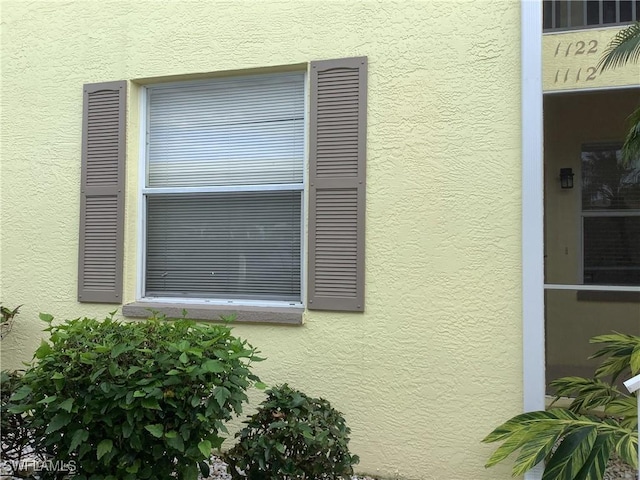 exterior details featuring stucco siding