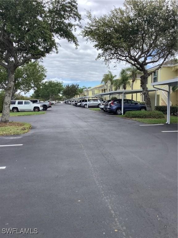 view of partially covered parking lot