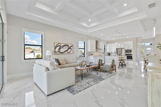 living area featuring recessed lighting, a healthy amount of sunlight, coffered ceiling, and baseboards