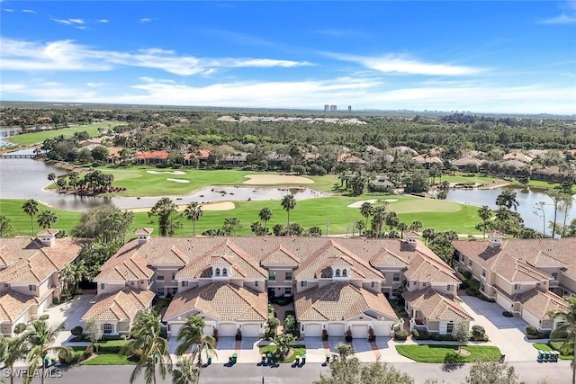 bird's eye view with a residential view, view of golf course, and a water view