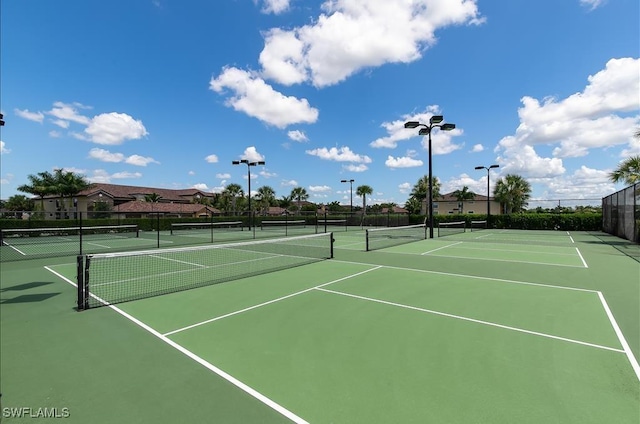 view of sport court featuring fence