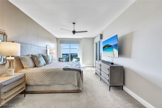 carpeted bedroom featuring ceiling fan and baseboards