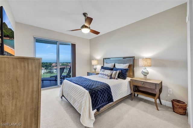 carpeted bedroom featuring access to outside, baseboards, and ceiling fan