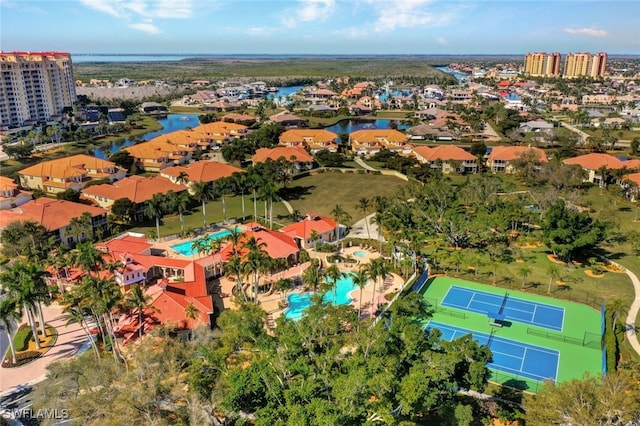 drone / aerial view featuring a water view and a city view