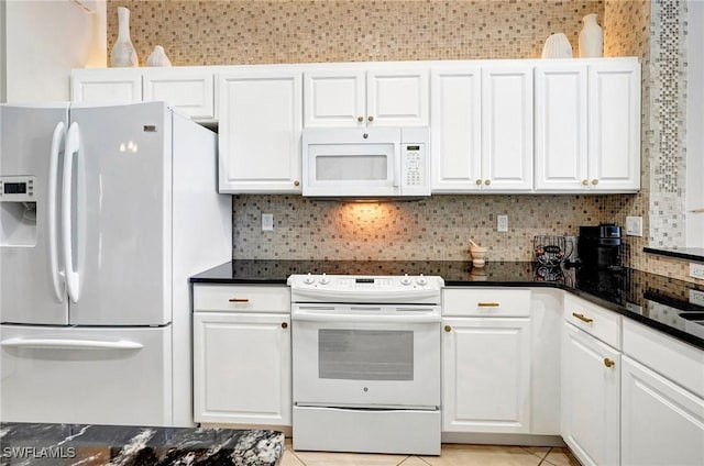 kitchen featuring light tile patterned floors, white appliances, white cabinets, and decorative backsplash