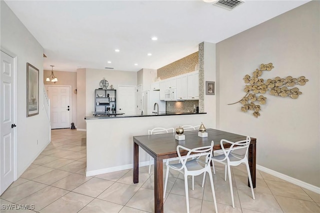 dining room featuring light tile patterned floors, baseboards, visible vents, and recessed lighting