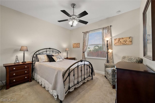 bedroom with baseboards, light carpet, and ceiling fan