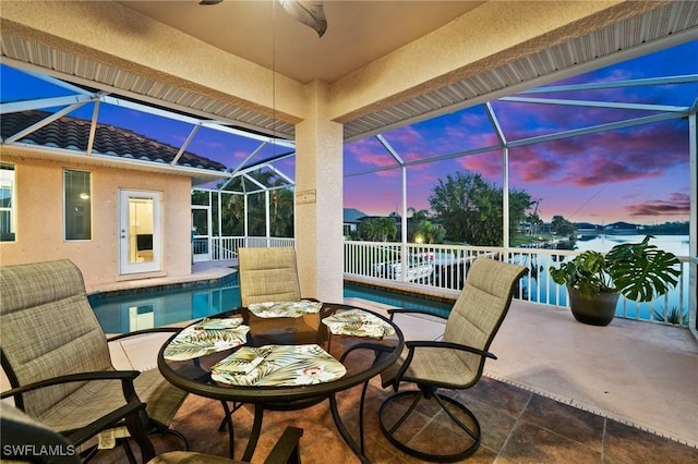 view of patio with a lanai and an outdoor pool