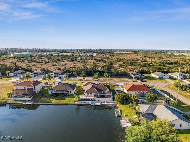 bird's eye view featuring a residential view and a water view