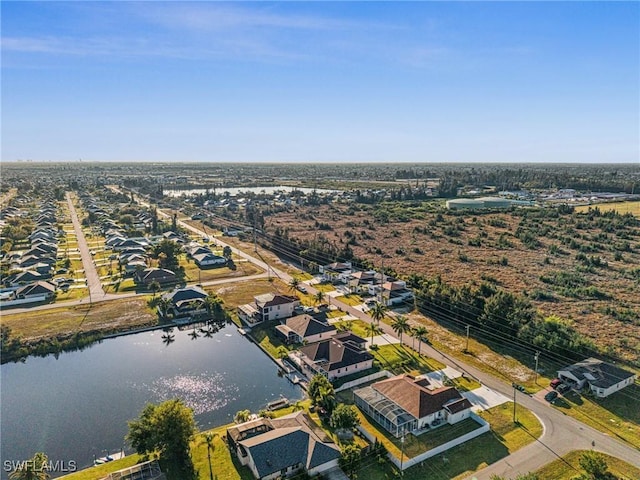 aerial view with a residential view and a water view