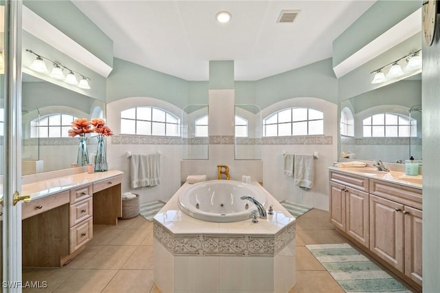 full bathroom with a tub with jets, visible vents, a walk in shower, tile walls, and tile patterned floors