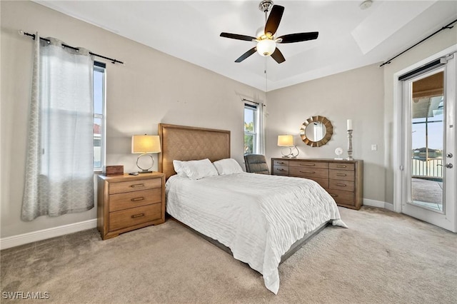 bedroom featuring light carpet, ceiling fan, baseboards, and access to outside