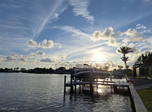 dock area with a water view and boat lift