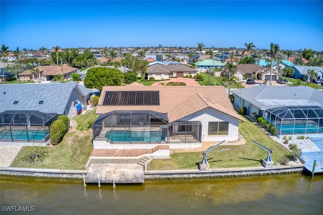 bird's eye view with a water view and a residential view