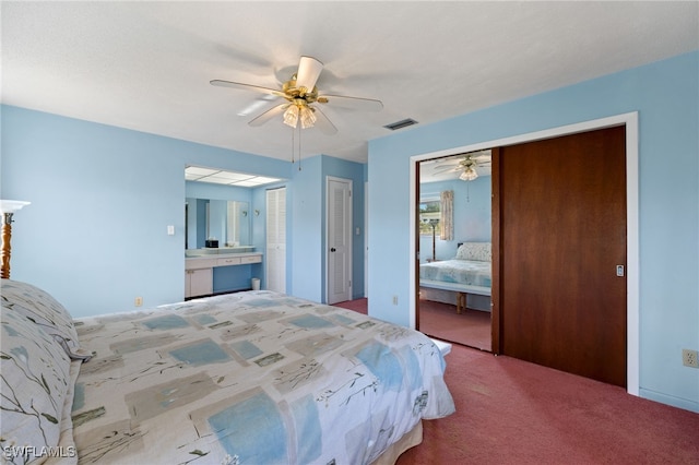 carpeted bedroom with visible vents and ceiling fan