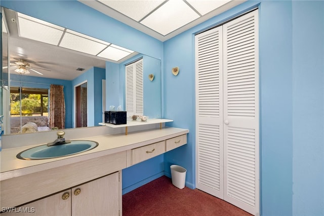 bathroom with ceiling fan, visible vents, a closet, and vanity