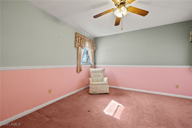 unfurnished room with carpet, baseboards, ceiling fan, and a textured ceiling