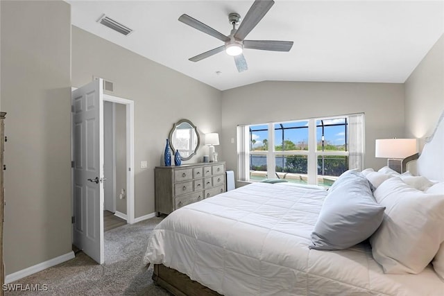 carpeted bedroom with visible vents, vaulted ceiling, baseboards, and ceiling fan