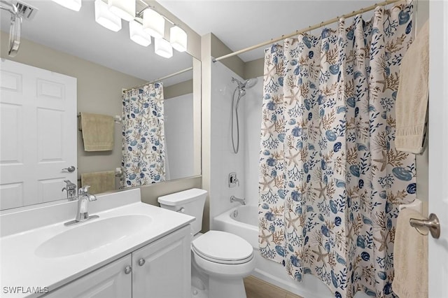 bathroom featuring visible vents, vanity, toilet, and shower / tub combo with curtain