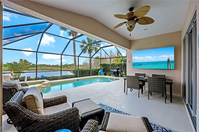 pool with glass enclosure, ceiling fan, and a patio