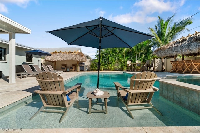 view of swimming pool featuring a patio area, fence, and a fenced in pool