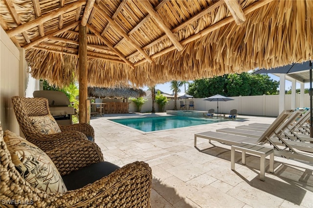 view of pool with a fenced in pool, a patio, a gazebo, area for grilling, and a fenced backyard