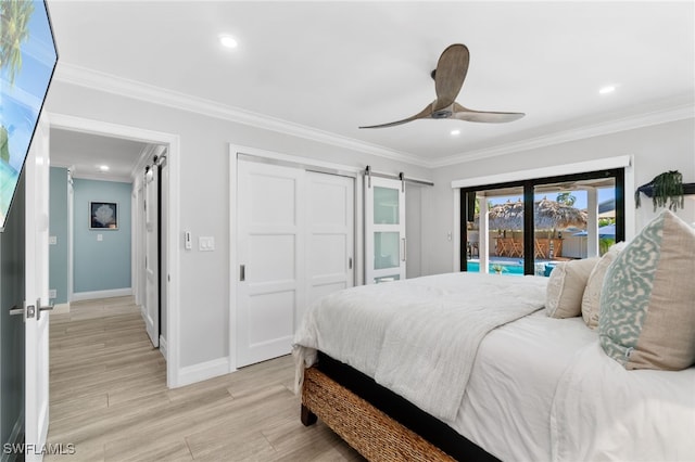 bedroom with access to outside, a barn door, light wood-type flooring, and crown molding