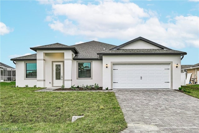 view of front of property with a garage, a shingled roof, decorative driveway, stucco siding, and a front yard