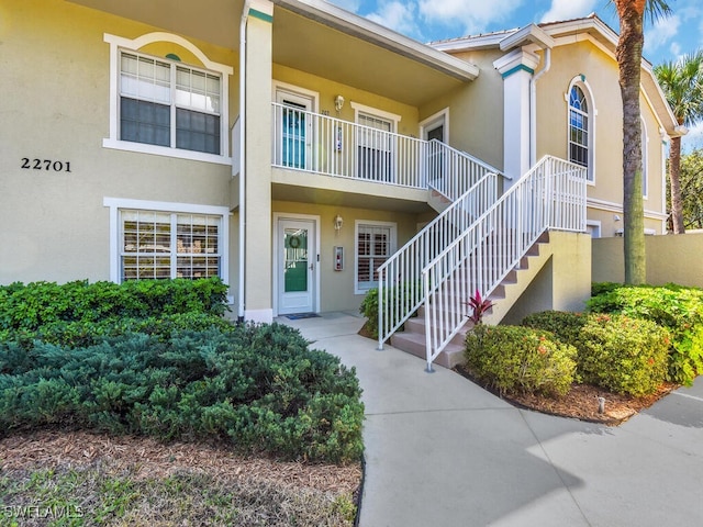 view of property featuring stairs