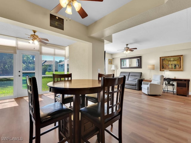 dining area featuring ceiling fan and wood finished floors