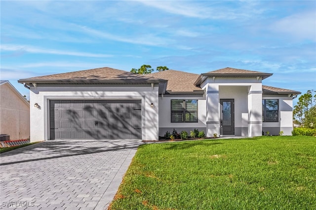 1705 SW 13th St, Cape Coral, FL 33991 - view of front of property with stucco siding, decorative driveway, a front lawn, a garage, and roof with shingles