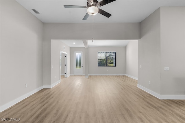 1705 SW 13th St, Cape Coral, FL 33991 - unfurnished living room featuring a ceiling fan, light wood finished floors, and baseboards