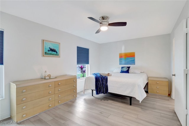 bedroom featuring ceiling fan and light wood-style floors