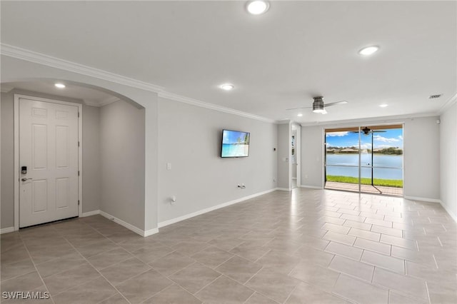 unfurnished room featuring baseboards, arched walkways, ceiling fan, crown molding, and recessed lighting