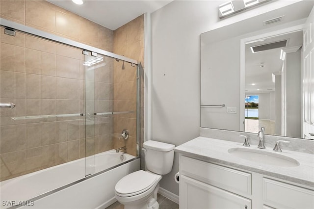 bathroom with toilet, shower / bath combination with glass door, visible vents, and vanity