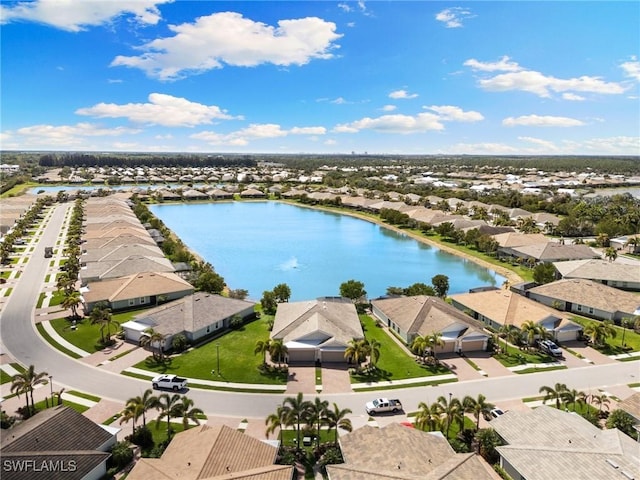 birds eye view of property with a residential view and a water view