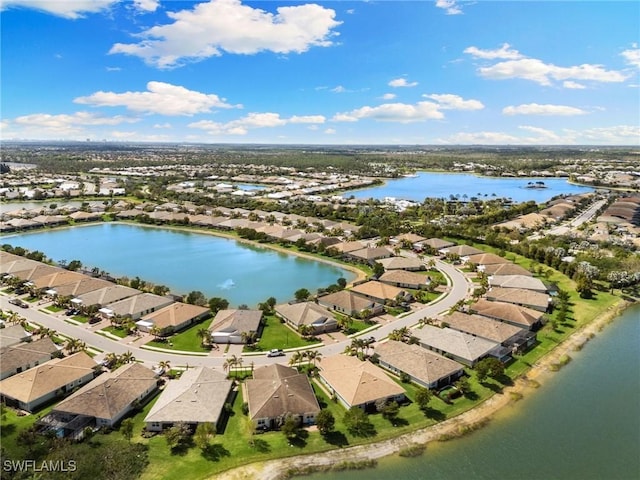 aerial view with a water view and a residential view