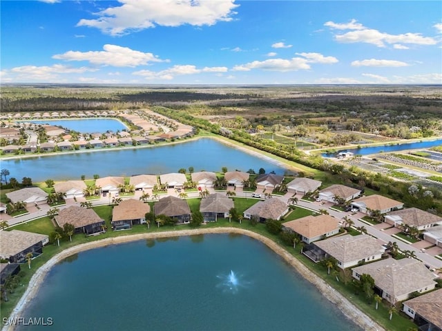 birds eye view of property featuring a water view and a residential view